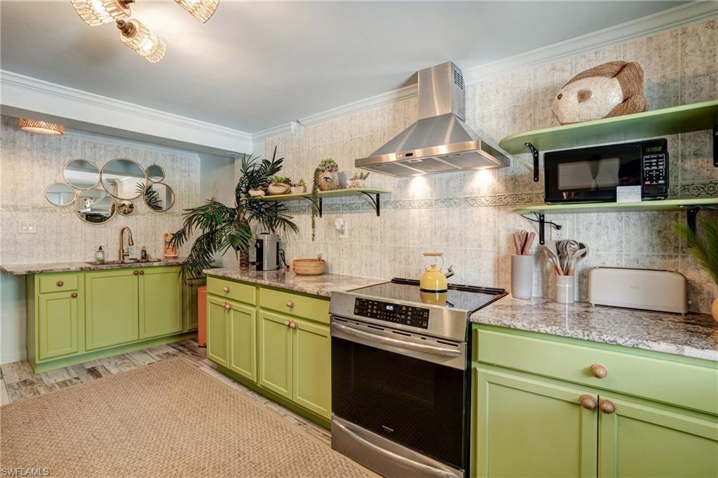 7146 Congdon Road Fort Myers, FL 33908 - Photo 28 of 50 a kitchen with granite countertop a sink cabinets and stainless steel appliances