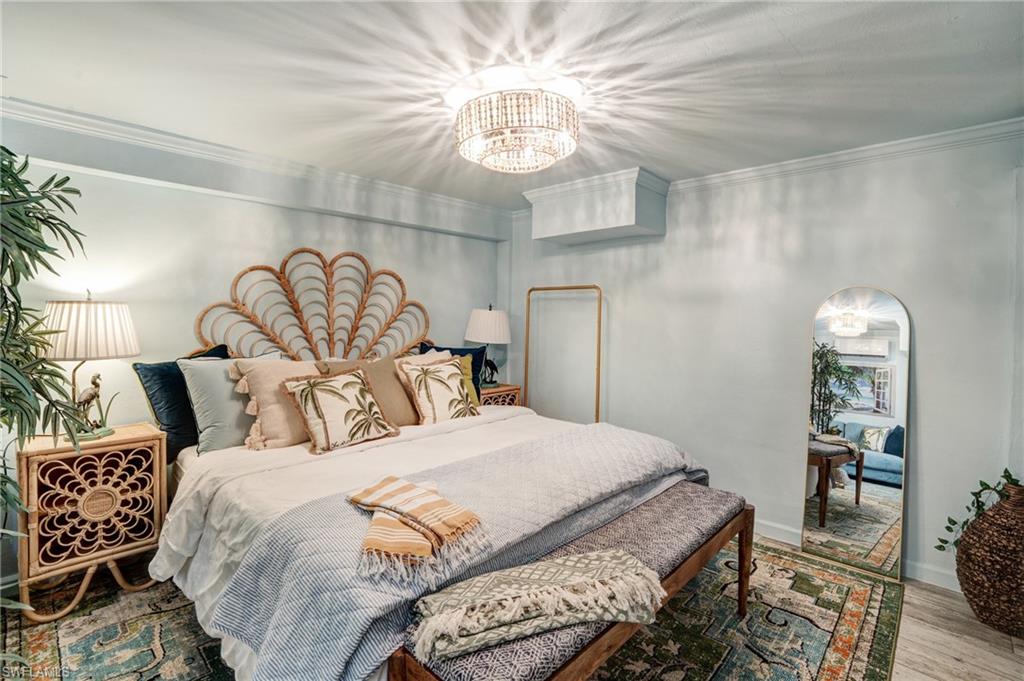 7146 Congdon Road Fort Myers, FL 33908 - Photo 33 of 50 a bedroom with a bed and wooden floor