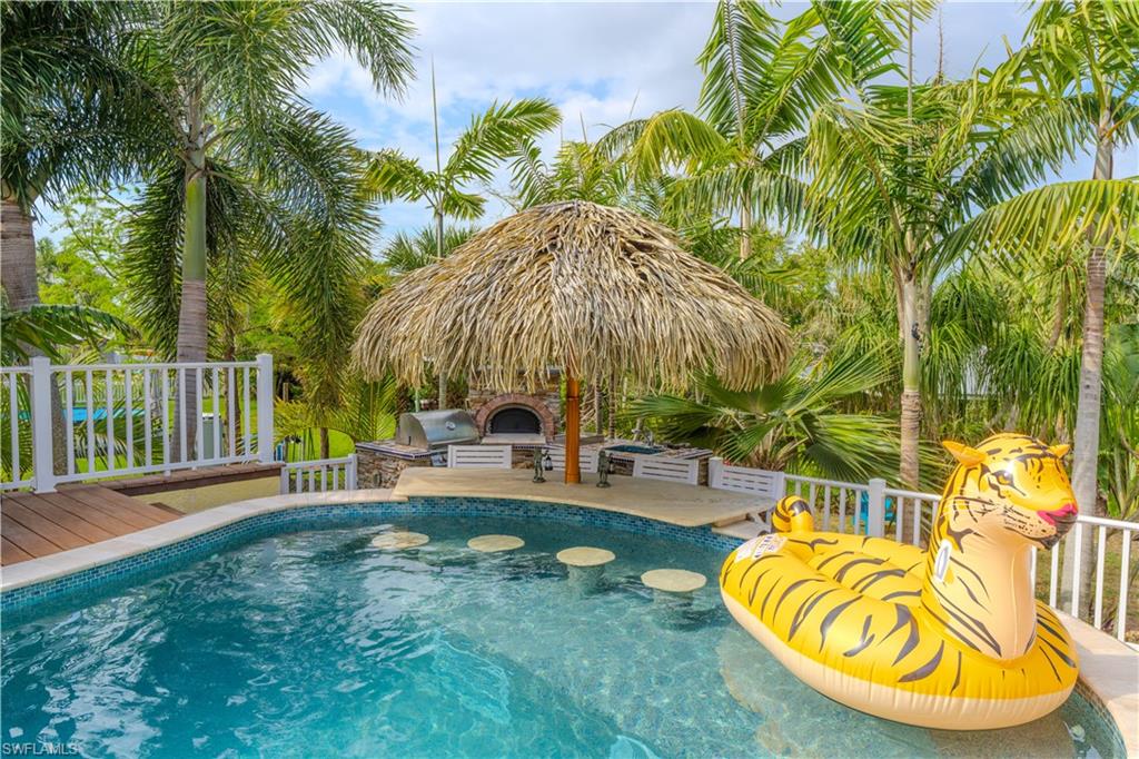 7146 Congdon Road Fort Myers, FL 33908 - Photo 36 of 50 swimming pool with outdoor seating yard and barbeque oven