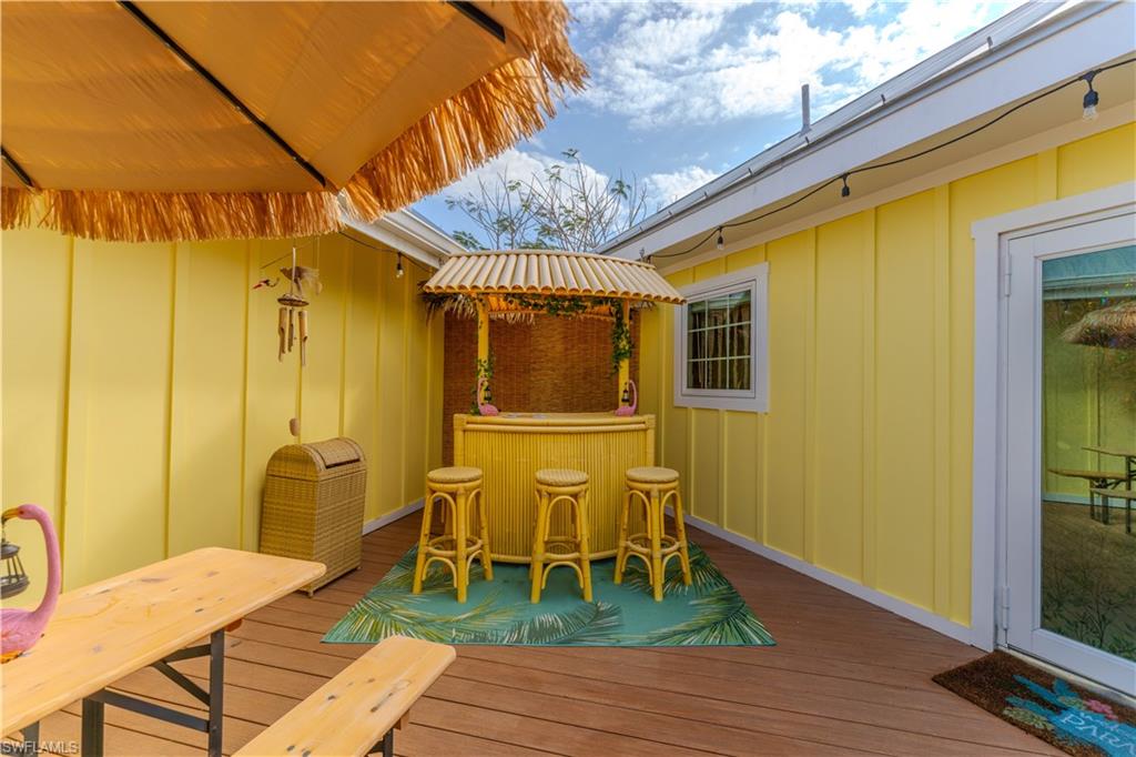7146 Congdon Road Fort Myers, FL 33908 - Photo 40 of 50 a balcony with table and chairs