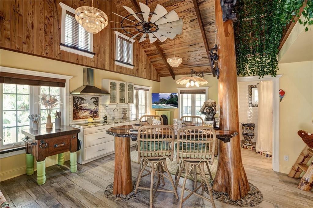 7146 Congdon Road Fort Myers, FL 33908 - Photo 4 of 50 a view of a dining room with furniture and wooden floor