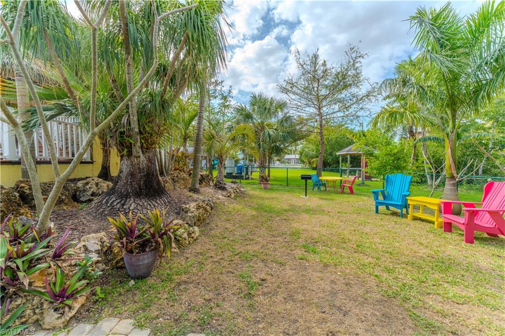 7146 Congdon Road Fort Myers, FL 33908 - Photo 42 of 50 a view of yard with swimming pool and sitting area