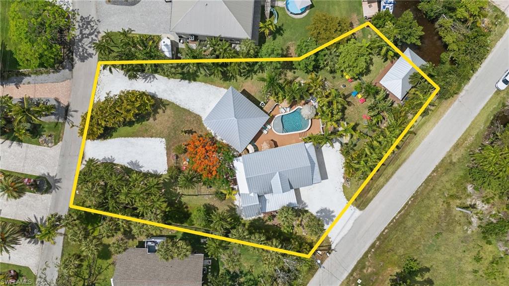 7146 Congdon Road Fort Myers, FL 33908 - Photo 48 of 50 an aerial view of house with a swimming pool