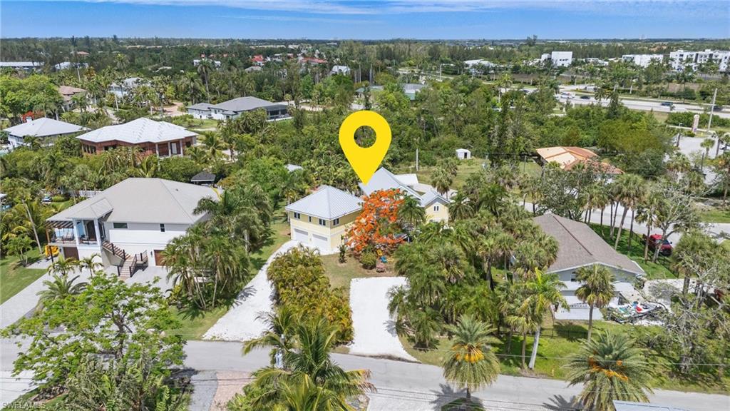 7146 Congdon Road Fort Myers, FL 33908 - Photo 49 of 50 a view of a house with a swimming pool and a yard
