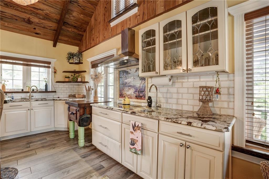 7146 Congdon Road Fort Myers, FL 33908 - Photo 5 of 50 a kitchen with a sink stove and cabinets