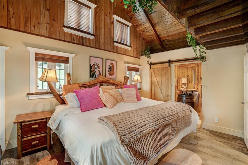 7146 Congdon Road Fort Myers, FL 33908 - Photo 10 of 50 a bedroom with a large bed and a closet