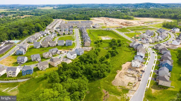 an aerial view of a house with a big yard