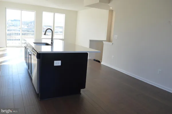 a view of kitchen with sink and window