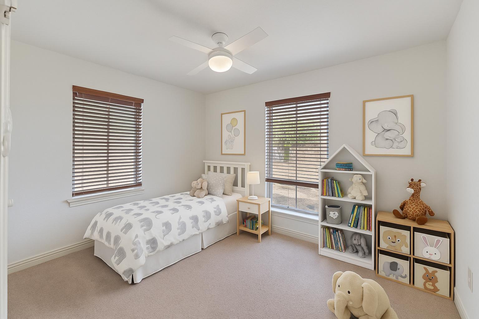 3705 Manorwood Road Austin, TX 78723 - Photo 10 of 13 a bedroom with furniture and a window
