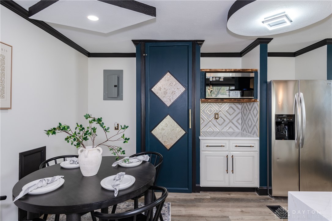 5240 Haverfield Road Dayton, OH 45432 - Photo 16 of 58 This inviting dining area features elegant design details and functional kitchen amenities.