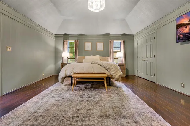 a bed room with a bed and a window