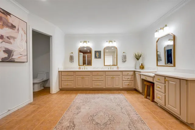 a bathroom with a double vanity sink mirror and bathtub