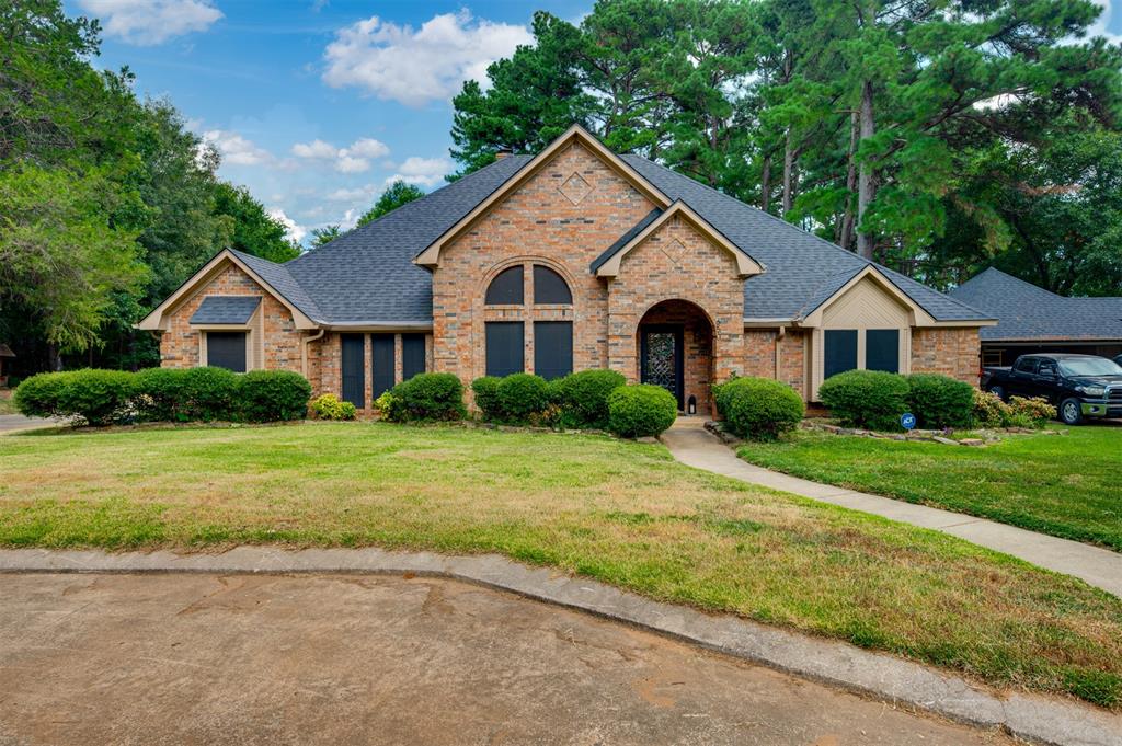 650 Spruce Drive Reno, TX 75462 - Photo 2 of 29 a front view of a house with a yard