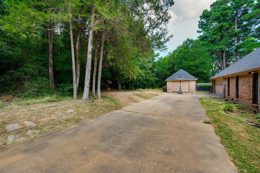 650 Spruce Drive Reno, TX 75462 - Photo 26 of 29 a front view of a house with yard and green space