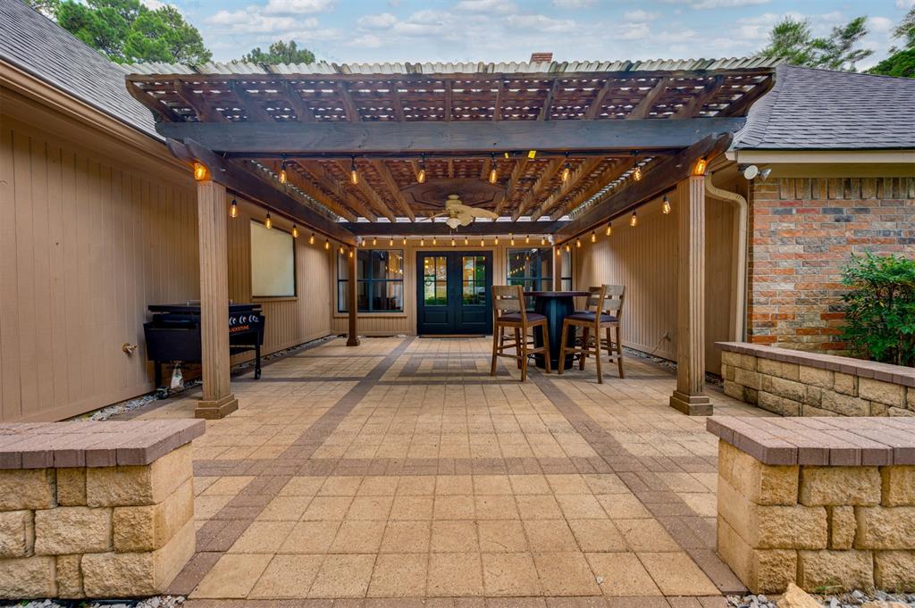 650 Spruce Drive Reno, TX 75462 - Photo 27 of 29 a view of a patio with table and chairs