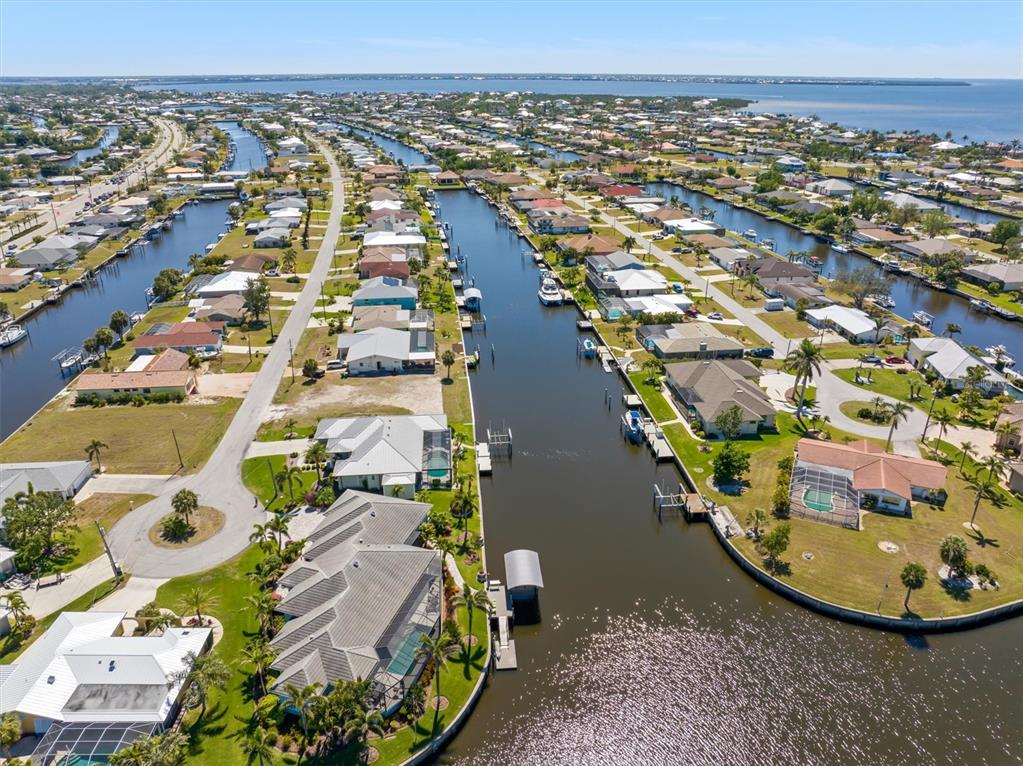 143 Leland Street Southwest Port Charlotte, FL 33952 - Photo 8 of 18 an aerial view of residential houses with outdoor space