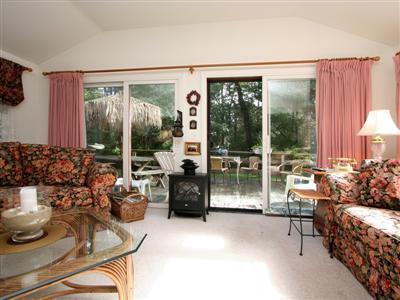 120 Hay Road Eastham, MA 02642 - Photo 11 of 25 a living room with furniture and a floor to ceiling window