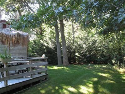 120 Hay Road Eastham, MA 02642 - Photo 24 of 25 a view of a wooden fence and trees