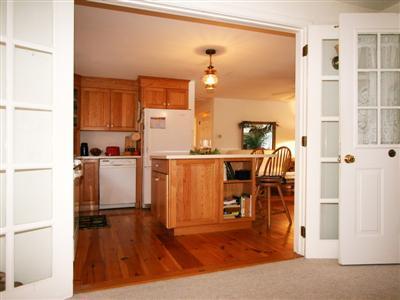120 Hay Road Eastham, MA 02642 - Photo 7 of 25 a kitchen with a refrigerator and wooden floor