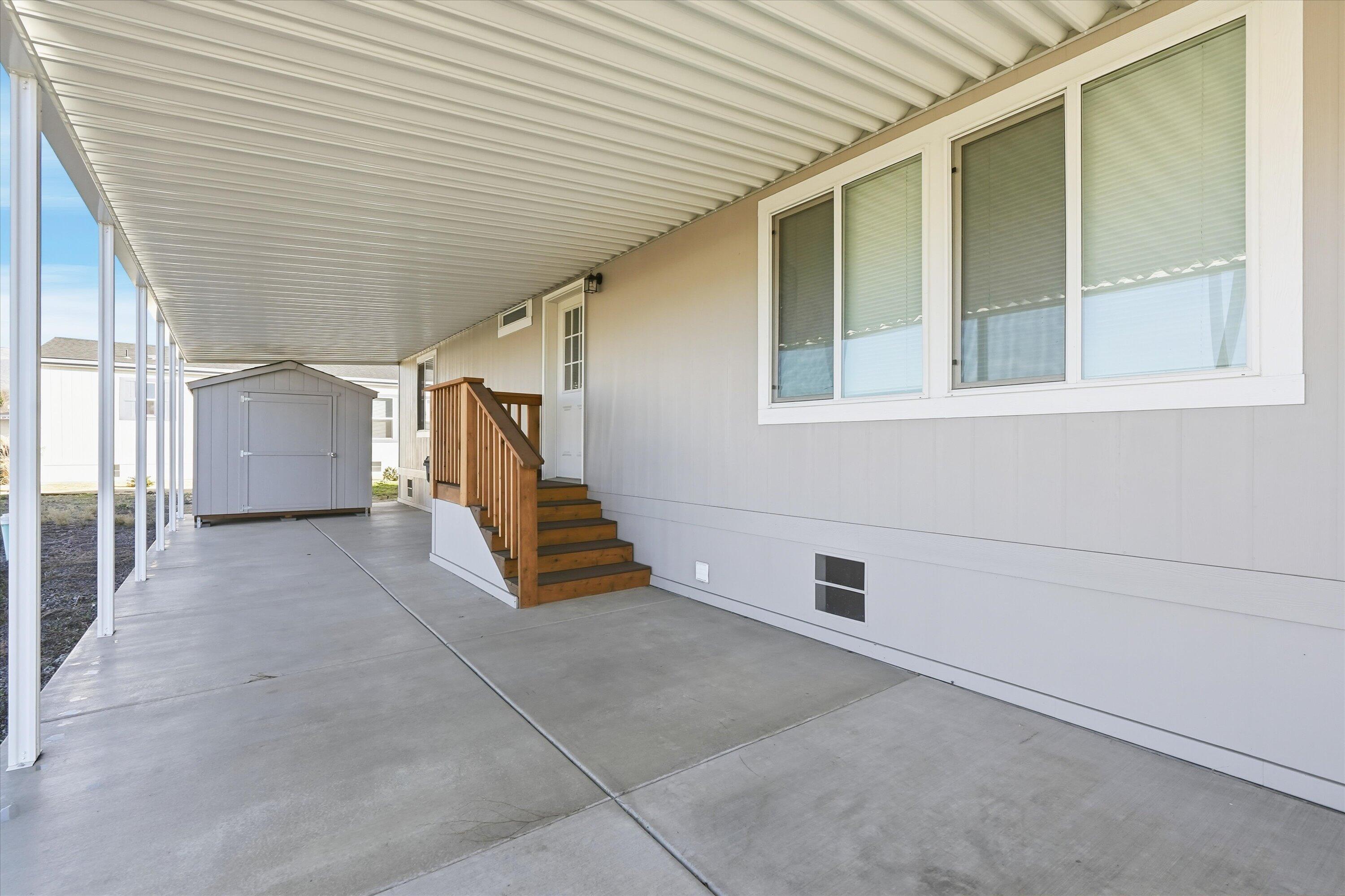 300 Luman Road, Unit 197 Phoenix, OR 97535 - Photo 23 of 26 a view of a patio with table and chairs