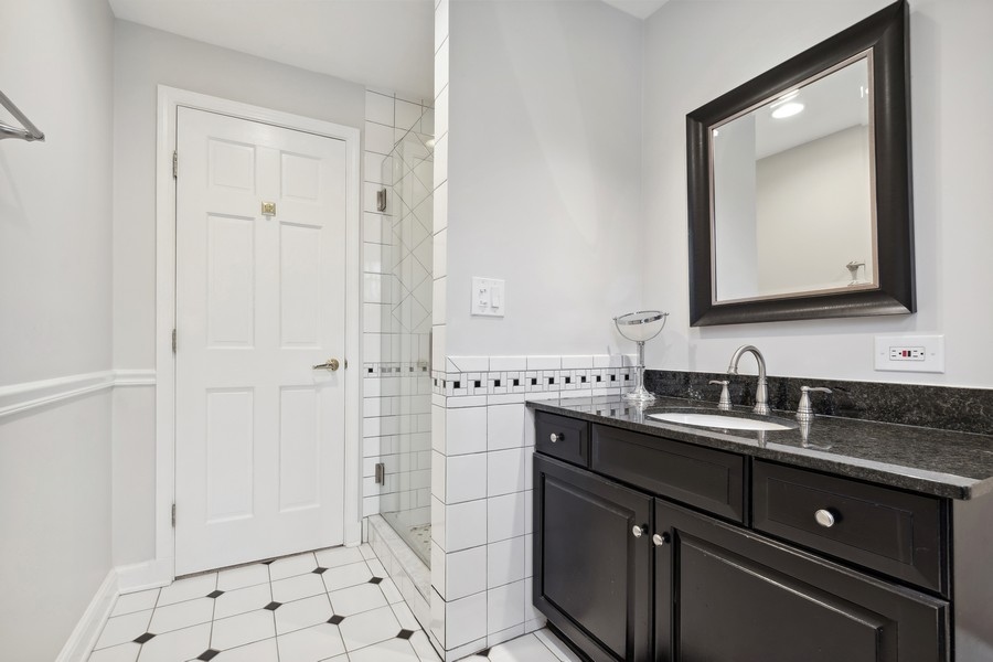 567 Rosemary Road Lake Forest, IL 60045 - Photo 21 of 42 a bathroom with a double vanity sink mirror and toilet