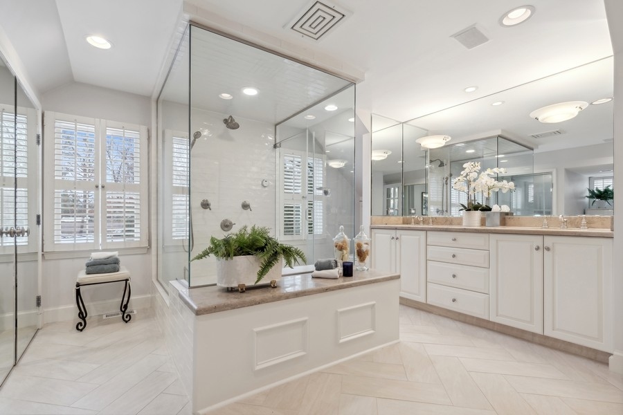 567 Rosemary Road Lake Forest, IL 60045 - Photo 24 of 42 a spacious bathroom with a granite countertop sink mirror and bathtub