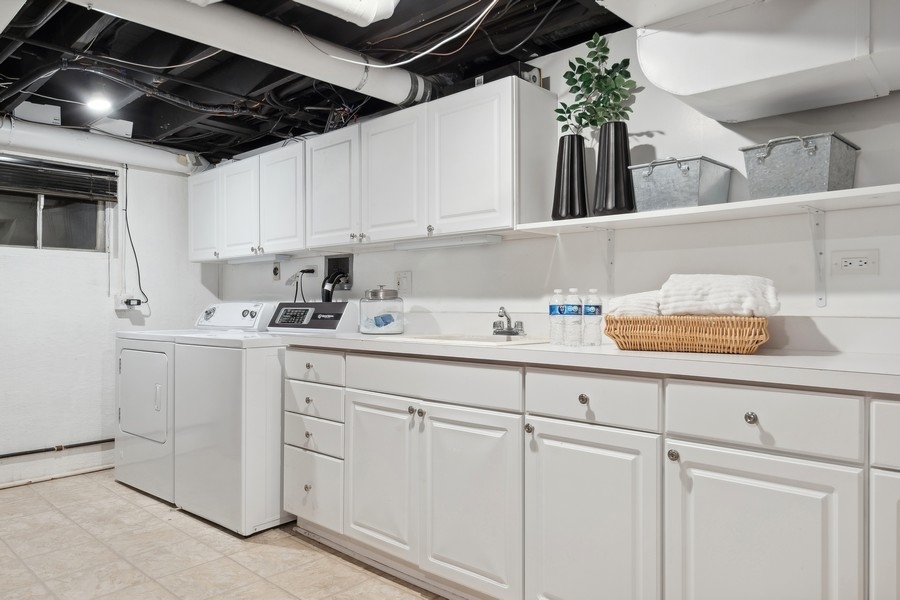 567 Rosemary Road Lake Forest, IL 60045 - Photo 31 of 42 a kitchen with white cabinets and white appliances