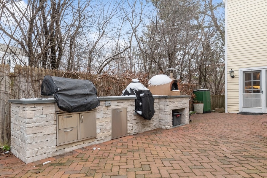 567 Rosemary Road Lake Forest, IL 60045 - Photo 32 of 42 a view of a patio with couches and fire pit