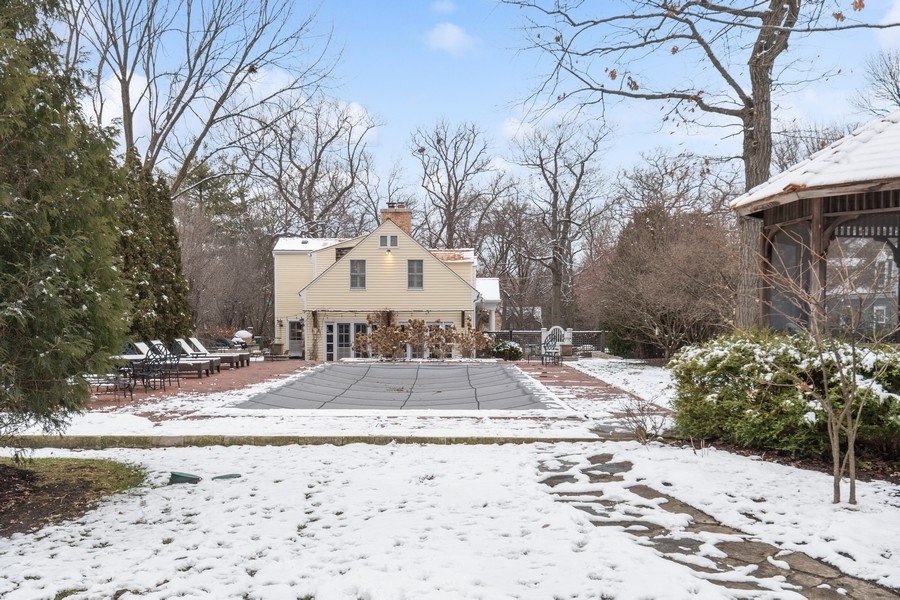 567 Rosemary Road Lake Forest, IL 60045 - Photo 38 of 42 a view of a white house with a snow on the road