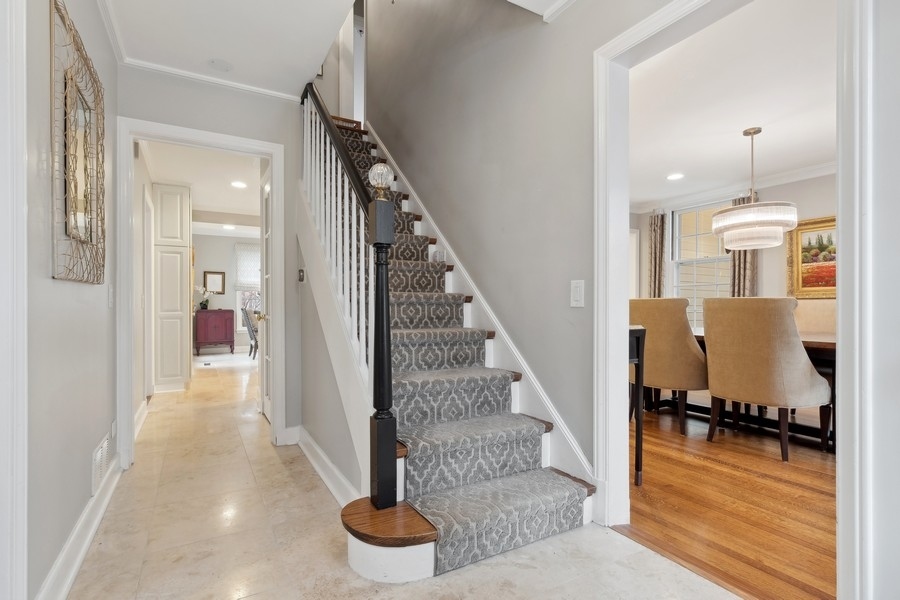 567 Rosemary Road Lake Forest, IL 60045 - Photo 4 of 42 a view of a hallway with wooden floor and staircase