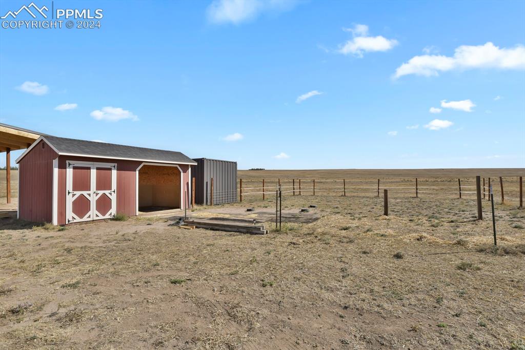 12155 Oil Well Road Calhan, CO 80808 - Photo 5 of 28 Loafing shed/Tack room and 10' Conex.