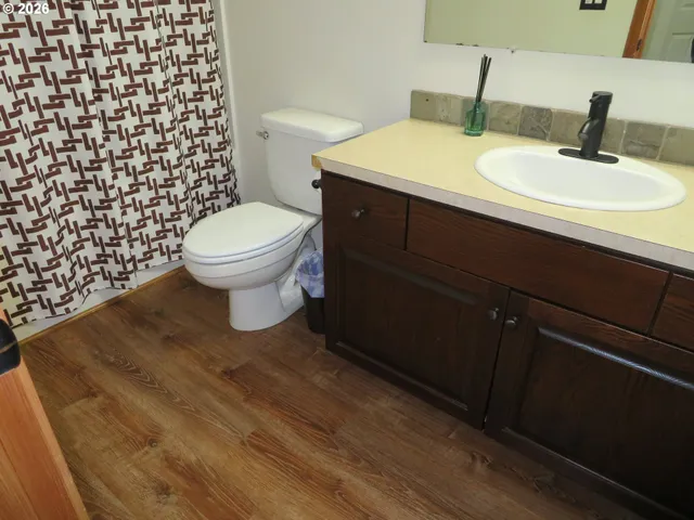 a bathroom with a toilet and a sink