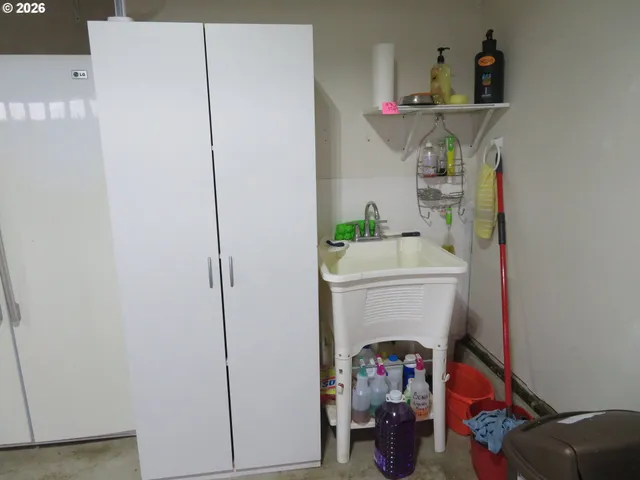 a view of a brick house with a small yard