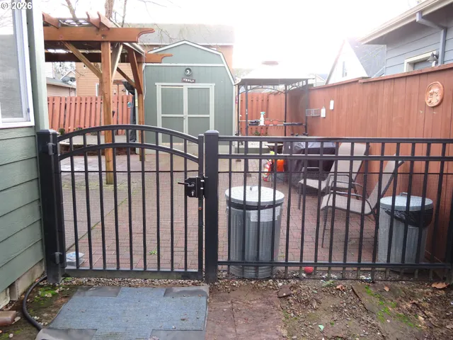 a view of a backyard with potted plants