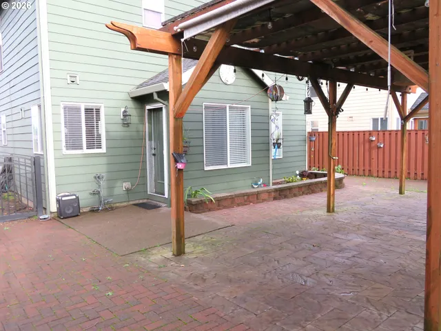 a view of a road with wooden fence