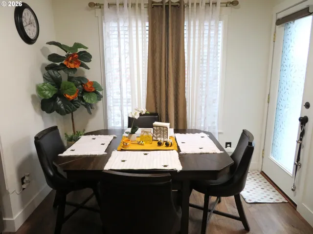 a view of a dining room with furniture and window
