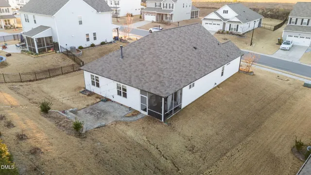 a view of a yard with a tree