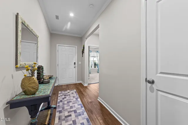 a view of a livingroom with workspace and a window