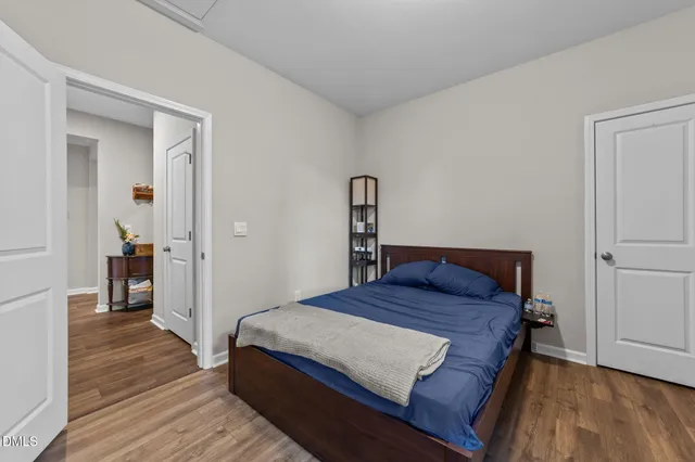 a kitchen with refrigerator and cabinets