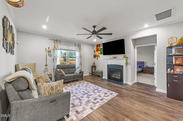 a bedroom with a bed rug and window