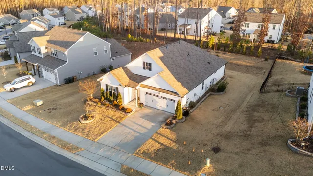 an aerial view of a house with a yard