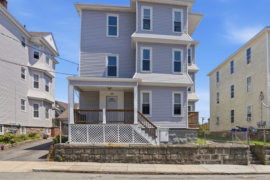 196 Irving Street Fall River, MA 02723 - Photo 2 of 34 a front view of a house with a yard