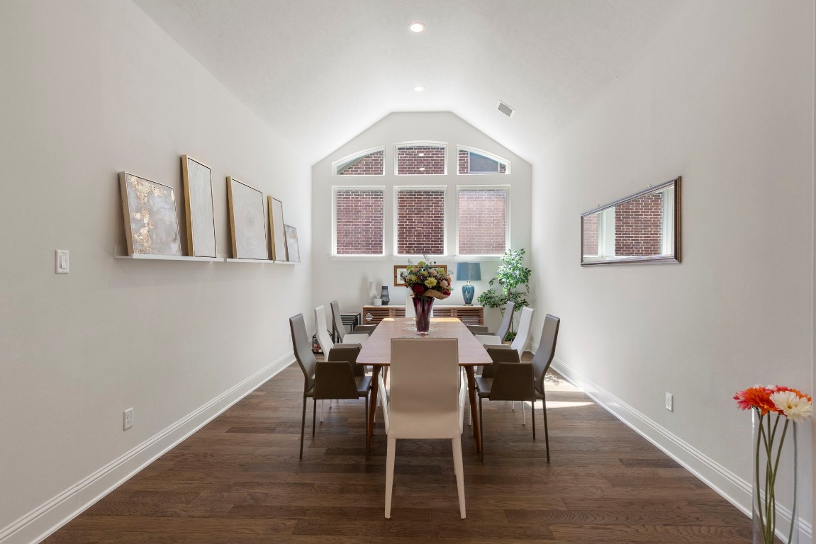 4115 Flagstone Pine Lane Spring, TX 77386 - Photo 13 of 40 The dining room is a versatile space, perfect for hosting large family gatherings and celebrations, yet intimate enough to set the stage for a romantic candlelit dinner for two. Its elegant design and warm ambiance make it an inviting setting for any occasion, whether grand or personal.