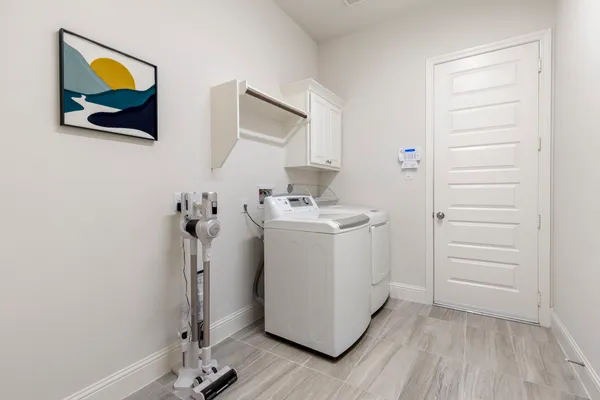 a utility room with washer and dryer