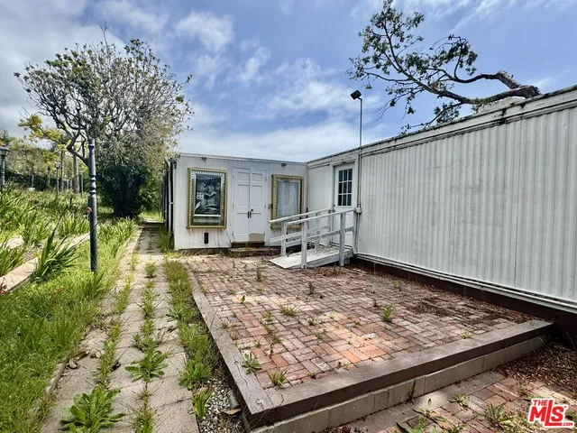 a view of outdoor space with deck and yard