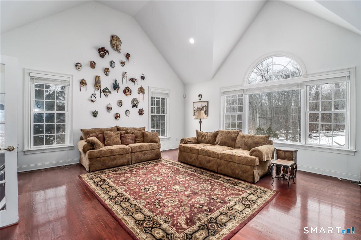 80 Maple Road Easton, CT 06612 - Photo 16 of 37 a living room with furniture and a large window