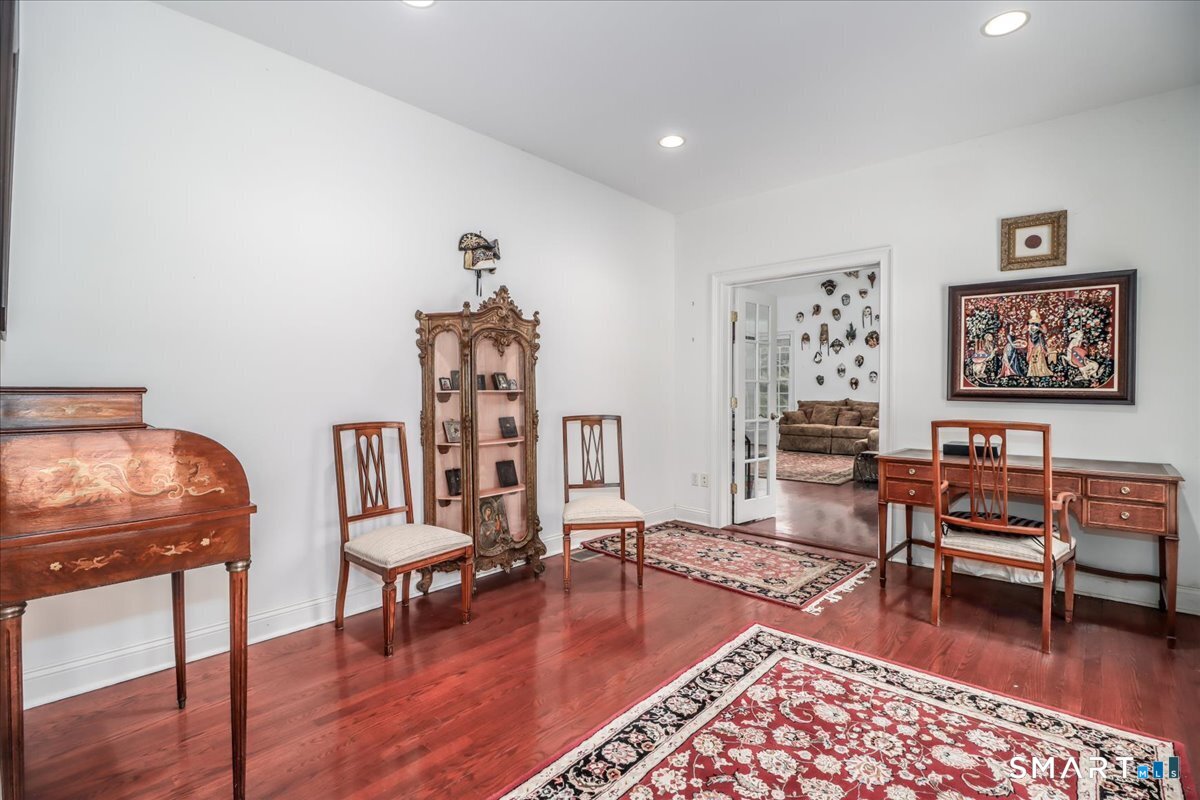 80 Maple Road Easton, CT 06612 - Photo 19 of 37 a living room with furniture and a wooden floor
