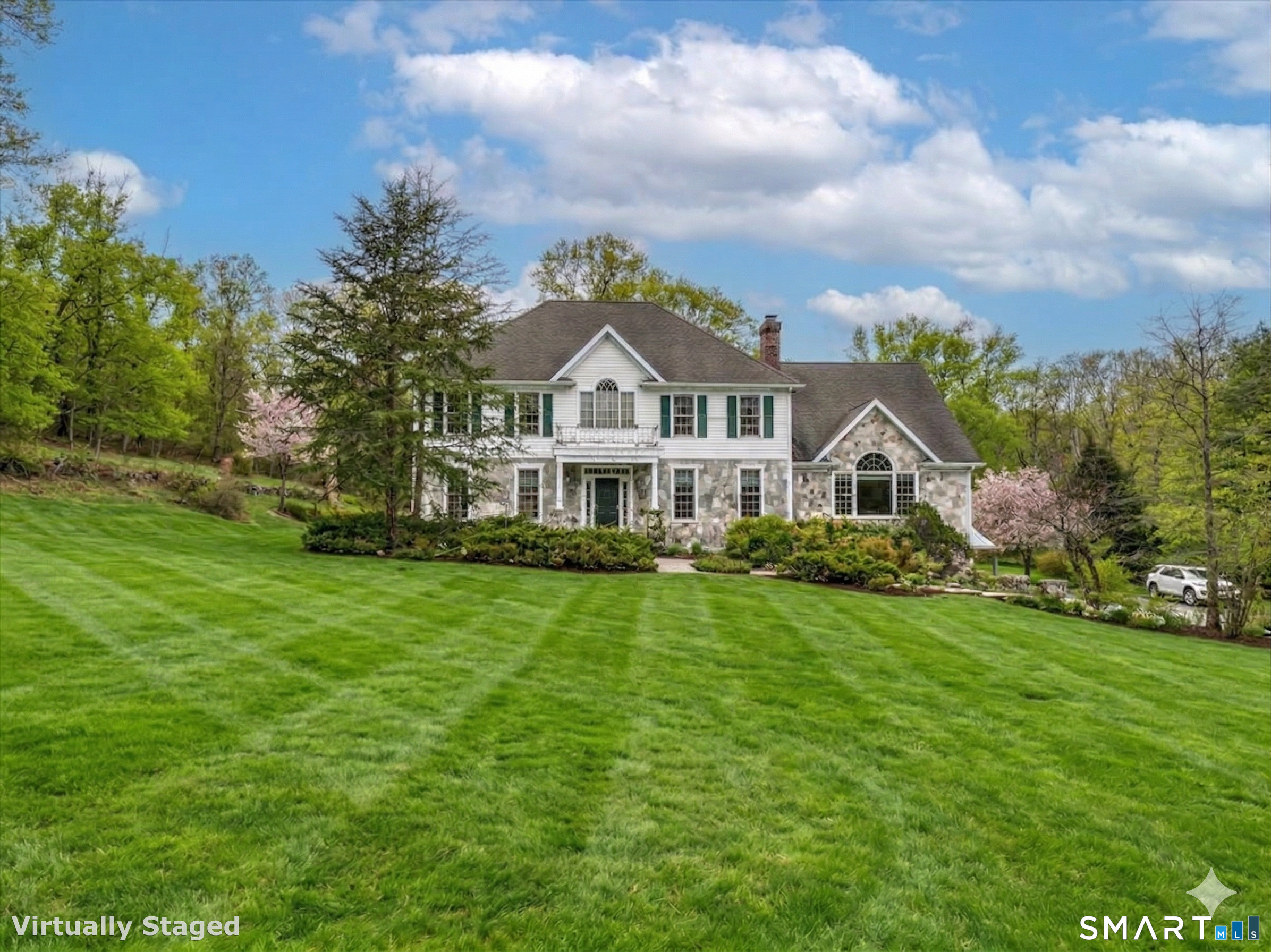 80 Maple Road Easton, CT 06612 - Photo 2 of 37 a front view of a house with a garden