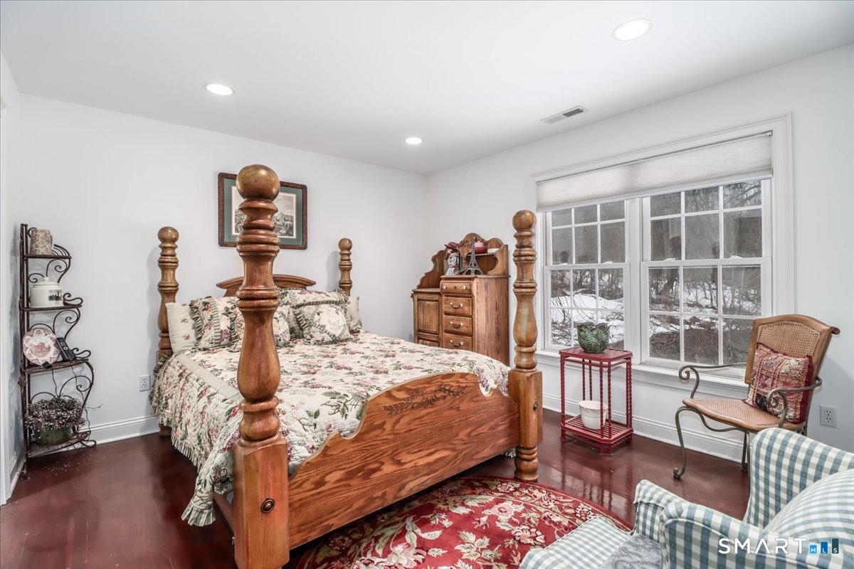 80 Maple Road Easton, CT 06612 - Photo 26 of 37 a bedroom with furniture and a table