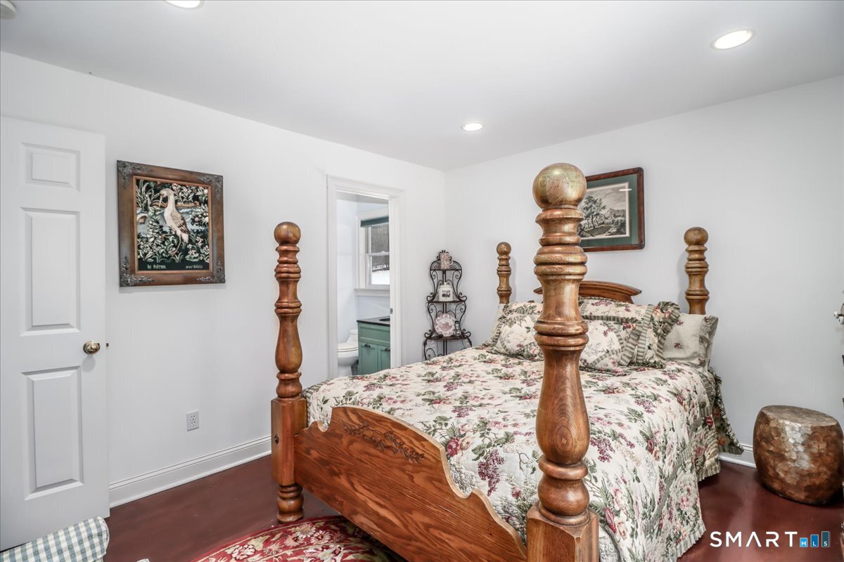 80 Maple Road Easton, CT 06612 - Photo 27 of 37 a bedroom with a bed and painting on the wall